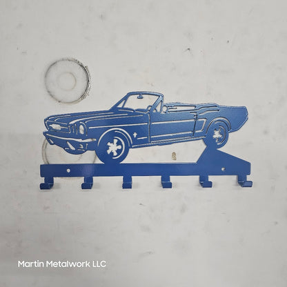 Blue metal car-shaped key holder on a gray background with 'Martin Metalwork LLC' branding.