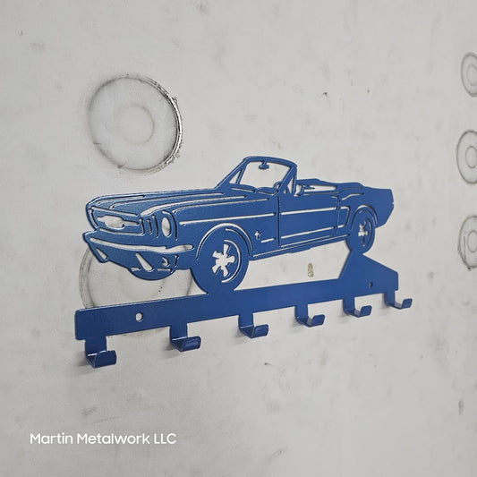 Blue car-shaped key holder on a light gray background with 'Martin Metalwork LLC' branding.